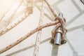 Rope on a yacht. Yacht rope cleat and sunlight. Sailboat winch and rope yacht detail. Yachting Royalty Free Stock Photo