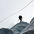 roped climbers on glacier with crevasses