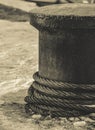 Ropes on a bollard with snow in the background