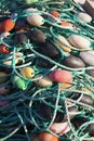 Ropes With Buoys From Fishing Nets In A Pile On The Waterfront Of Fishing Port