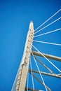 Ropes of a cable-stayed bridge against a blue sky Royalty Free Stock Photo