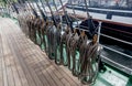 Ropes on a deck of a sailing ship. Equipment of sailing boat and ship`s exterior. Concept of travel, adventure and sea.