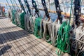 Ropes on a deck of a sailing ship. Equipment of sailing boat and ship`s exterior. Concept of travel, adventure and sea.