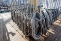 Ropes on a deck of a sailing ship. Equipment of sailing boat and ship`s exterior