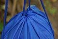 Ropes pull together a blue backpack a bag made of synthetic fabric Royalty Free Stock Photo