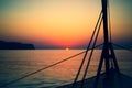 Ropes on a Sailboat With Sunrise and Islands in the Background Royalty Free Stock Photo