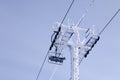 Closeup ropes of ski lift, cable car funicular with pillar on th