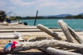 Ropes on a wooden pier on the background of the sea, mountains in Montenegro