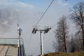 Ropeway or cable way to the foggy mountains