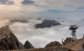 Ropeway gondola to top of Zugspitze, Bavarian alps. Dense clouds over the mountains. Zugspitze, Bavaria, Germany Royalty Free Stock Photo