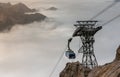 Ropeway gondola to top of Zugspitze, Bavarian alps. Dense clouds over the mountains. Zugspitze, Bavaria, Germany Royalty Free Stock Photo