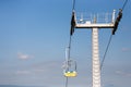 Ropeway mountain lift against blue clear sky, background