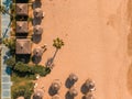 ropical landscape with palm trees, parasols, white sand, ocean. Royalty Free Stock Photo