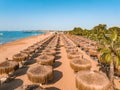 ropical landscape with palm trees, parasols, white sand, ocean. Royalty Free Stock Photo