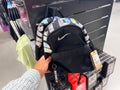 Confident Grip: Male Hand with Nike Backpack Just Do It