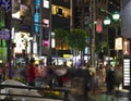 Roppongi intersection at night with people on the pedestrian crossing