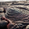 Ropy p hoehoe lava flows are shown with distinct, smooth and ropelike textures Royalty Free Stock Photo