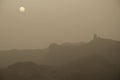 Roque Nublo at dawn on a day of airbone dust.