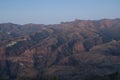 Roque Nublo and village of El Toscon to the left at sunset.