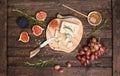 Roquefort  or Blue cheese serving with grapes, honey and figs. Cheese plate Royalty Free Stock Photo