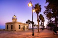 Roquetas de mar, Spain; August 29th 2021: Lighthouse of Roquetas de Mar between golden hour and blue hour Royalty Free Stock Photo