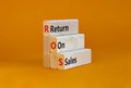 ROS return on sales symbol. Concept words ROS return on sales on wooden blocks. Beautiful orange table, orange background, copy Royalty Free Stock Photo
