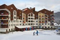 Rosa Khutor, Sochi, Russia, January, 26, 2018. Dad and son on the slopes in front of the hotel `Rosa skinn` in the Olympic village