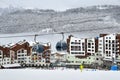 Rosa Khutor, Sochi, Russia, January, 25, 2018, Cabins of ropeway `Olympia` on the background of hotels Rosa Skinn and Rosa Sprin