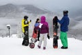 Rosa Khutor, Sochi, Russia, January, 25, 2018. Group of snowboarders at Rosa Plateau in fog