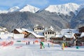Rosa Khutor, Sochi, Russia, January, 26, 2018. Instructor and little boy skiing on the child`s training slope in the background of