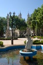 rosario .argentina,santa fe province,wather fountain and sculture,bachground cathedral