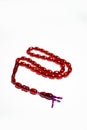 Rosary with amber beads isolated on white background. Royalty Free Stock Photo
