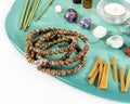 Rosary beads, aroma sticks, chakra stones, sandalwood sticks and candle Royalty Free Stock Photo