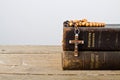 Rosary beads and books of Catholic Church liturgy Royalty Free Stock Photo