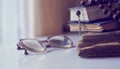 The rosary beads on Catholic Church liturgy books and old glasses on the side of them. Royalty Free Stock Photo