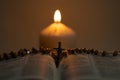 Rosary beads with cross on top of holy bible Royalty Free Stock Photo