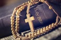 Rosary beads and crucifix cross on holy bible Royalty Free Stock Photo
