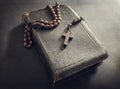 Rosary beads and crucifix cross on holy bible Royalty Free Stock Photo