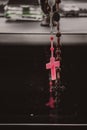 Rosary beads hanging in the mirror in the car Royalty Free Stock Photo