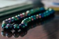 Rosary beads on table. Shallow depth of field Royalty Free Stock Photo