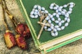 Rosary, bible and dried roses on the table Royalty Free Stock Photo