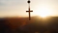 Rosary crucifix at sunset light