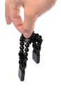 Rosary in hand on a white background isolated Royalty Free Stock Photo