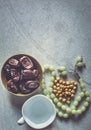 Rosary, Iftar sweets and dried fruits with a cup of water. View from above. Flat lay photo