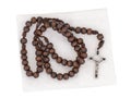 Rosary isolated with pouch on white background. Christian cross, crucifix, wooden beads. Royalty Free Stock Photo