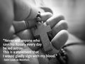 Rosary quote - Never will anyone who says his Rosary everyday be led astray. With rosary in hand background. Royalty Free Stock Photo