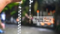 Rosary quote - Pray The Rosary every day. Praying rosary concept with person holding rosary beads in hand.