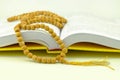 Rosary on yellow praying book Royalty Free Stock Photo