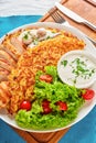 Roschti with grilled chicken, mushrooms and salad