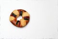 The roscÃÂ³n, rosca de Reyes or king cake, a torus-shaped sweet dough bun decorated with slices of candied or crystallized fruit